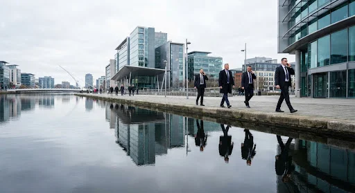 Vigilant close protection team escorting executives along the Dublin docklands